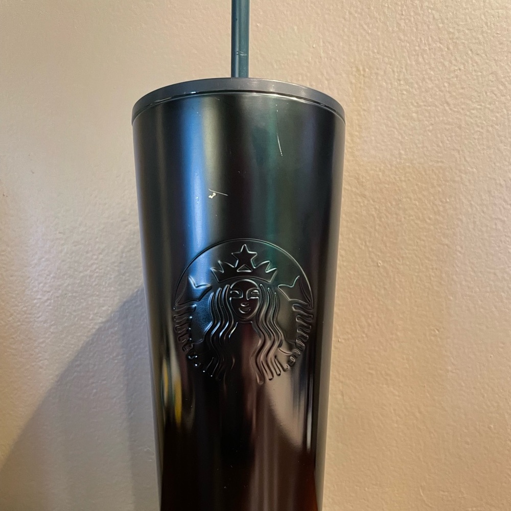 Venti Starbucks cup. Scratches shown